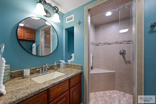 bathroom with vanity and walk in shower