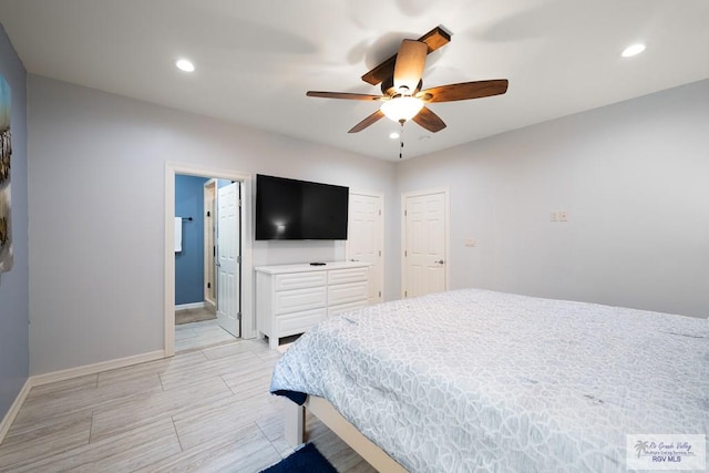 bedroom with ceiling fan and connected bathroom