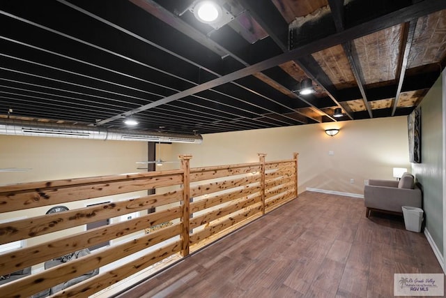 basement featuring hardwood / wood-style floors