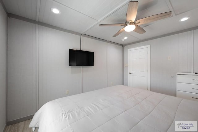 bedroom featuring ceiling fan and wood-type flooring