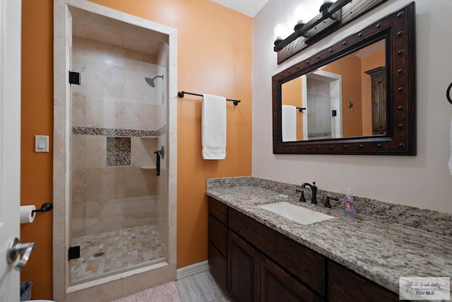 bathroom featuring vanity and walk in shower