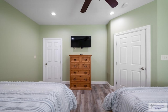 bedroom featuring ceiling fan and wood-type flooring