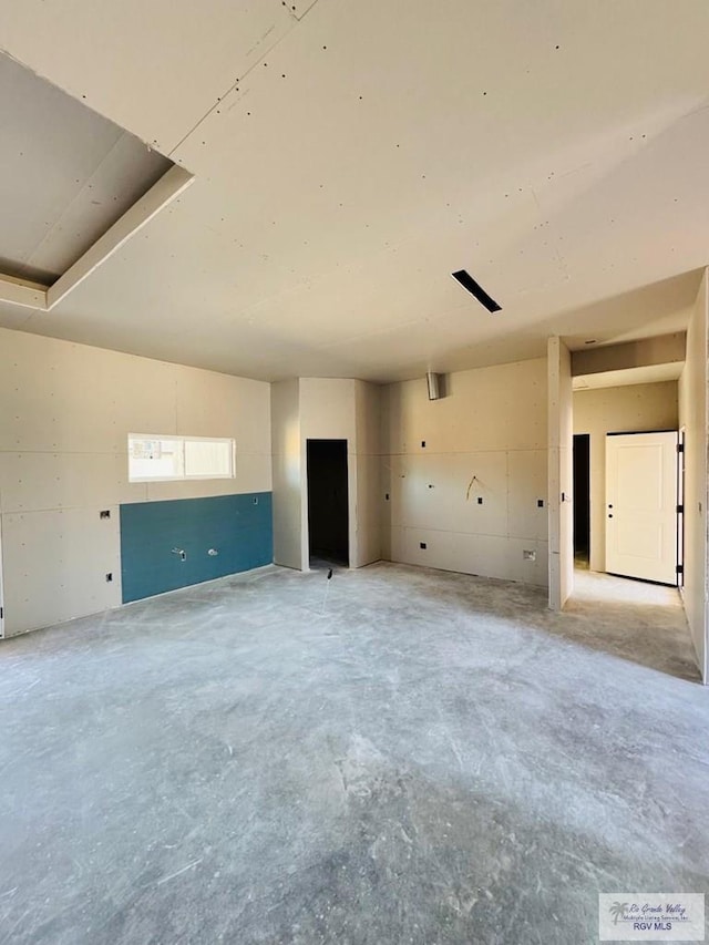 825 Milania Dr, La Feria, TX 78589 - empty room with unfinished concrete flooring