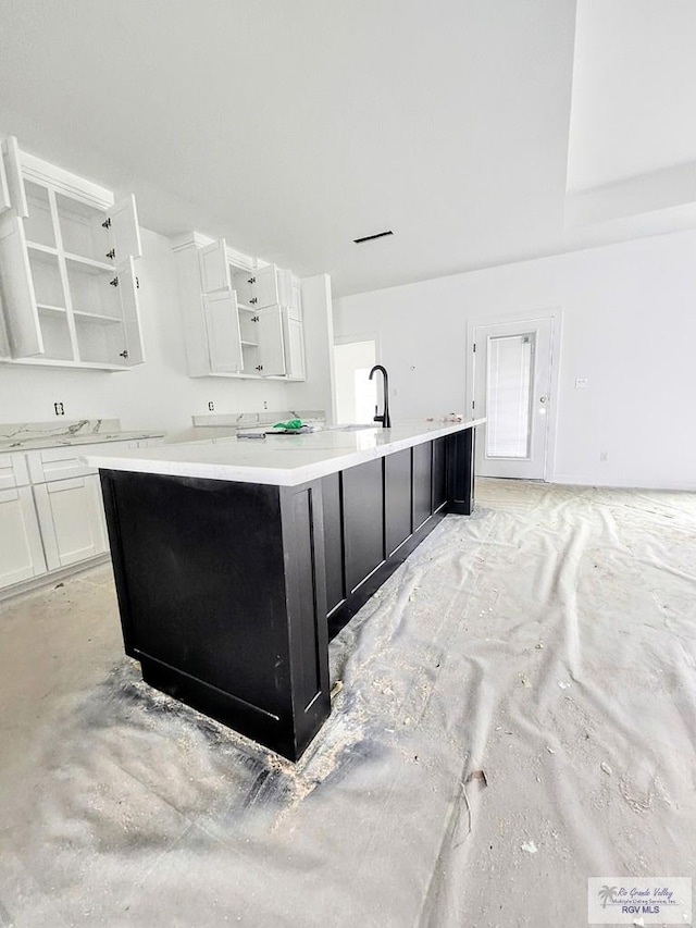 bathroom with sink and concrete floors