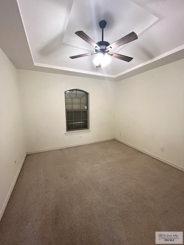 1522 Autumn Ct Lot 23, Harlingen, TX 78552 - empty room with a tray ceiling, carpet, and ceiling fan