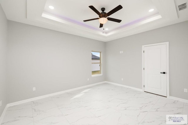 802 Olivia Dr, Mercedes, TX 78570 - unfurnished room featuring ceiling fan and a tray ceiling