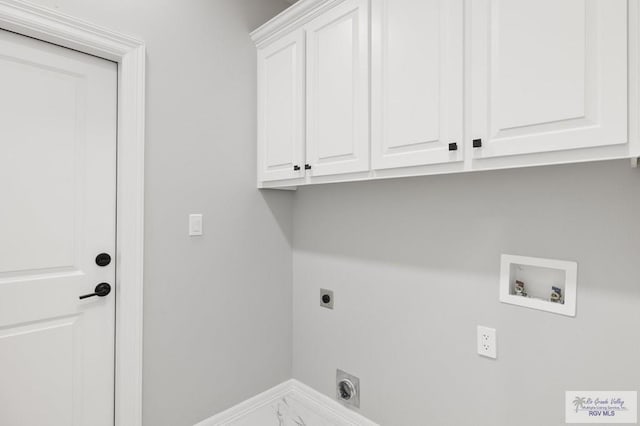 802 Olivia Dr, Mercedes, TX 78570 - laundry room with washer hookup, hookup for an electric dryer, and cabinets