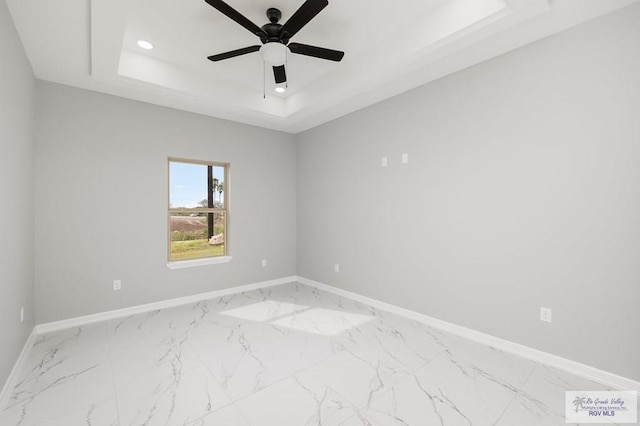 802 Olivia Dr, Mercedes, TX 78570 - unfurnished room featuring ceiling fan and a tray ceiling