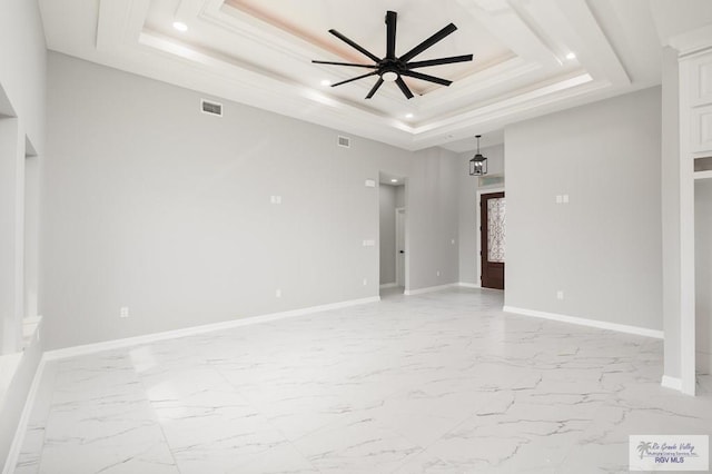 802 Olivia Dr, Mercedes, TX 78570 - spare room with a raised ceiling and ceiling fan
