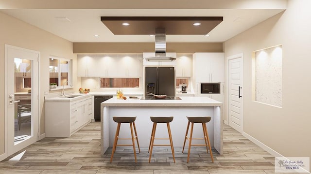 kitchen with exhaust hood, a kitchen island, white cabinets, and black appliances