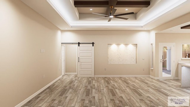 empty room with light wood-type flooring, beam ceiling, a barn door, and coffered ceiling