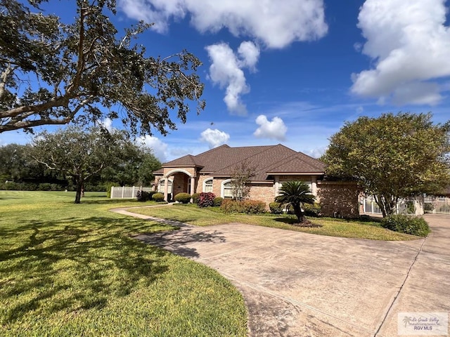 ranch-style home with a front yard