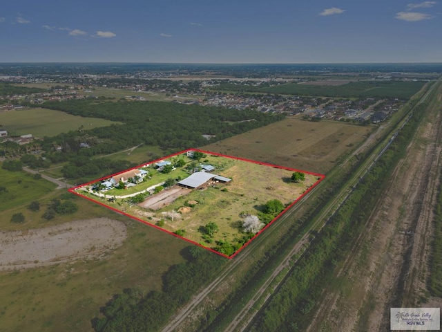 birds eye view of property with a rural view