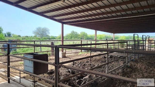 view of stable featuring a rural view