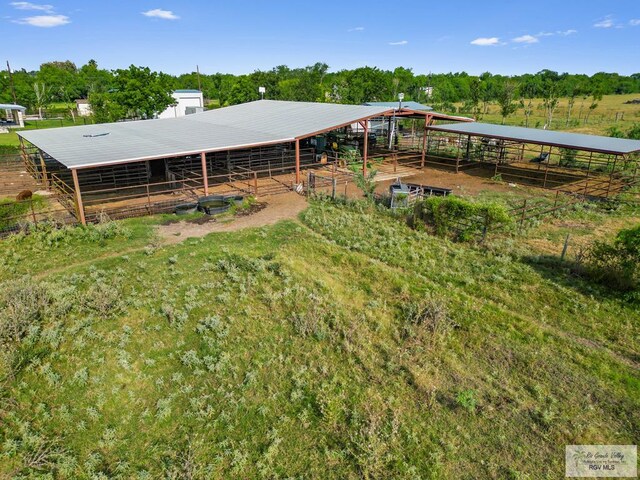 exterior space featuring an outbuilding and a rural view