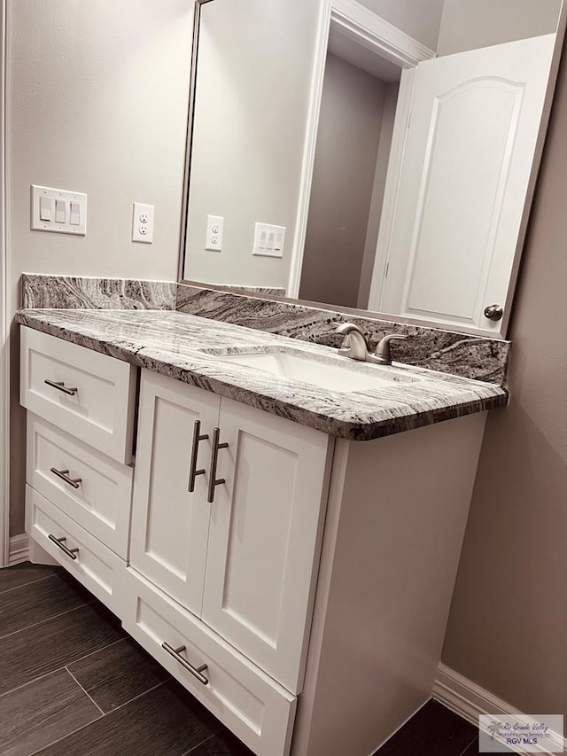 bathroom featuring wood-type flooring and vanity