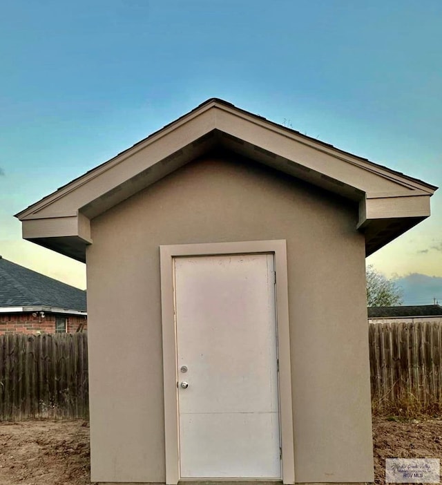 view of outdoor structure at dusk