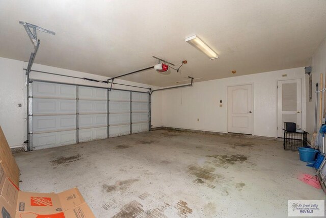 garage featuring a garage door opener