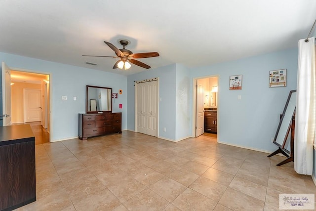 bedroom featuring connected bathroom and ceiling fan