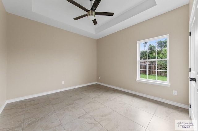 2402 S Christian Cir, Harlingen, TX 78550 - unfurnished room featuring ceiling fan and a tray ceiling