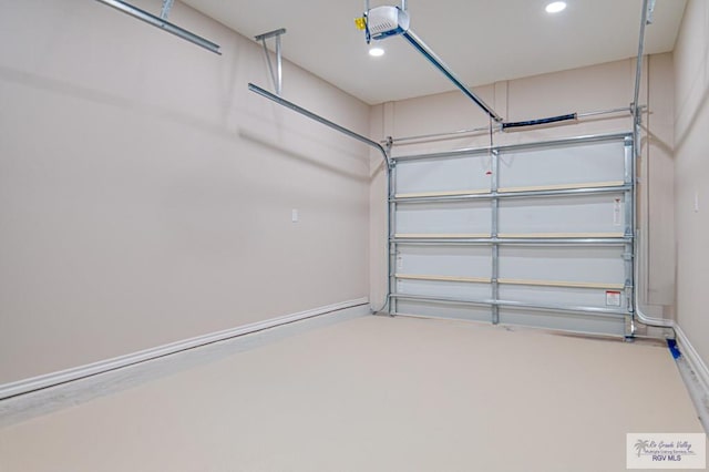 garage featuring baseboards, recessed lighting, and a garage door opener