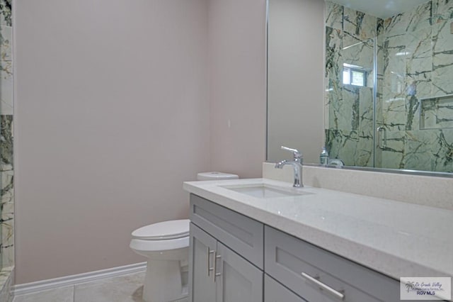 full bath with a marble finish shower, toilet, vanity, tile patterned flooring, and baseboards