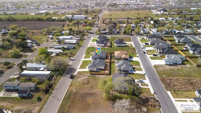 birds eye view of property with a residential view