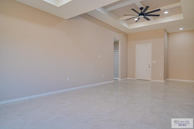 empty room with ceiling fan, baseboards, and coffered ceiling