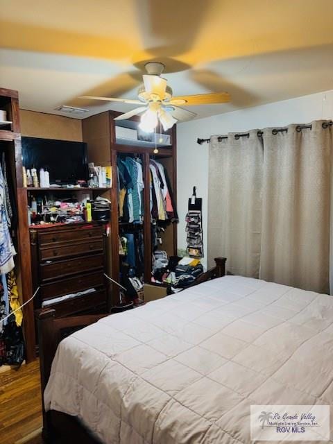 bedroom featuring hardwood / wood-style flooring and ceiling fan