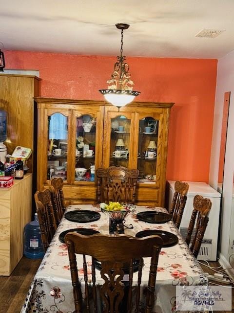 217 E Mckinley Ave, Harlingen, TX 78550 - dining room featuring dark hardwood / wood-style floors