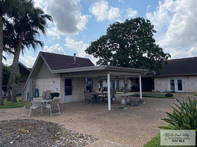 back of property featuring french doors and a patio area