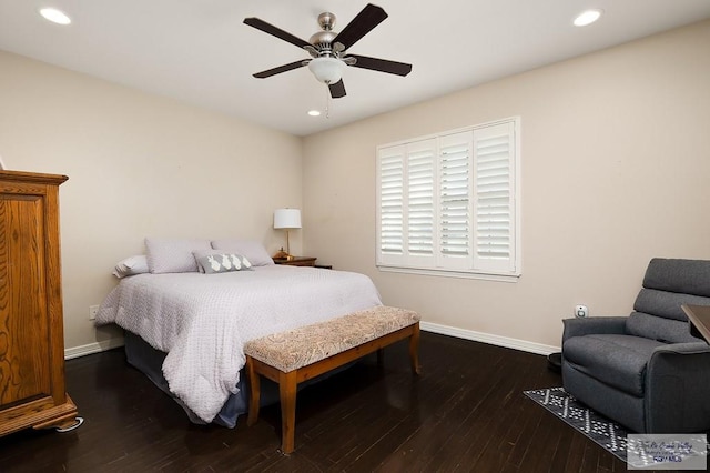 bedroom with ceiling fan and dark hardwood / wood-style floors