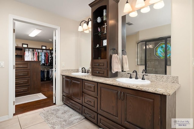 bathroom with vanity and hardwood / wood-style flooring