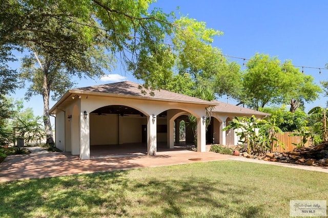 mediterranean / spanish house featuring a front yard