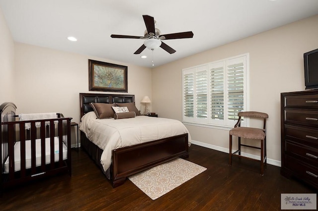 bedroom featuring ceiling fan and dark wood-type flooring