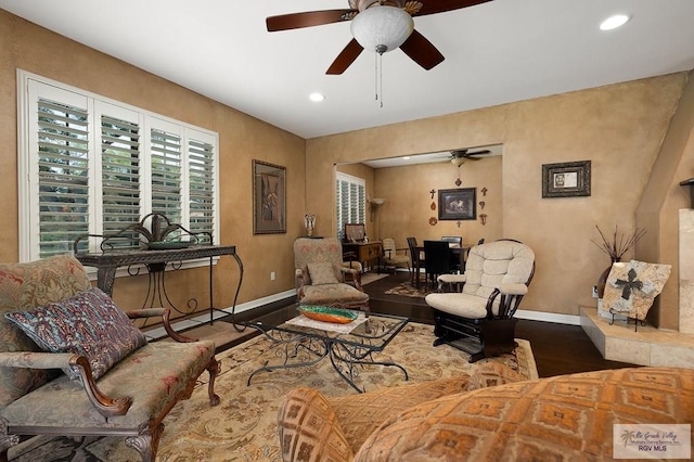 living room featuring ceiling fan and wood-type flooring