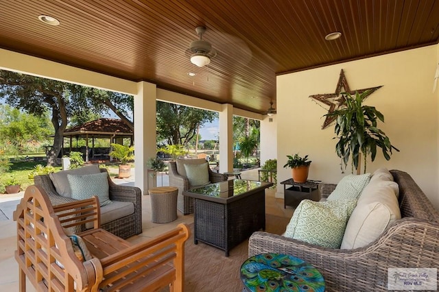 view of patio featuring outdoor lounge area and a gazebo