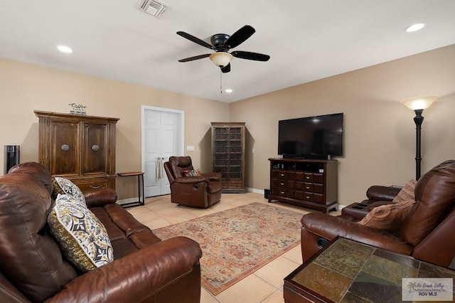 tiled living room with ceiling fan