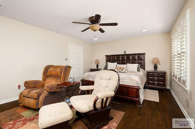 bedroom featuring ceiling fan and dark hardwood / wood-style floors