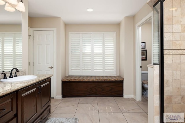 bathroom featuring vanity and toilet