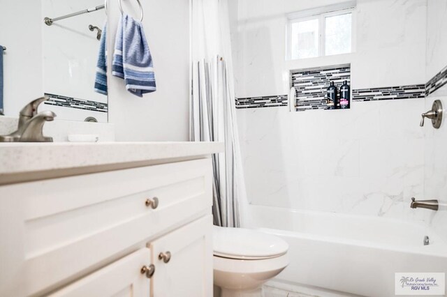 full bathroom featuring vanity, toilet, and shower / tub combo with curtain