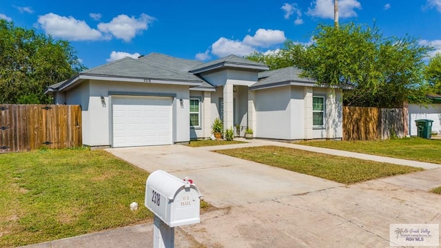 2318 W Arbor St, Harlingen, TX 78552 - view of front of property with concrete driveway, a garage, and stucco siding