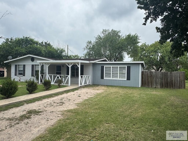 44 Highland Ter, Brownsville, TX 78521 - ranch-style home featuring a porch and driveway