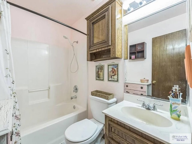 full bathroom featuring vanity, shower / bath combination with curtain, and toilet