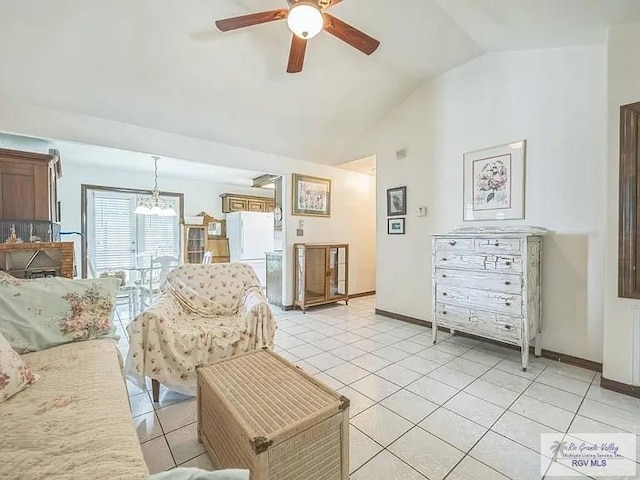 living room featuring ceiling fan, lofted ceiling, and light tile patterned floors