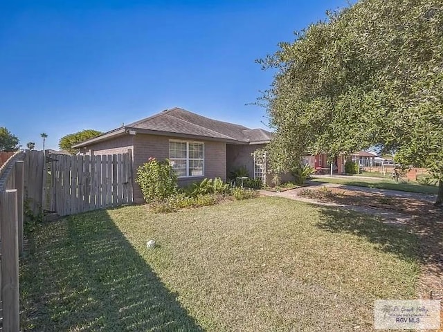 view of home's exterior with a lawn