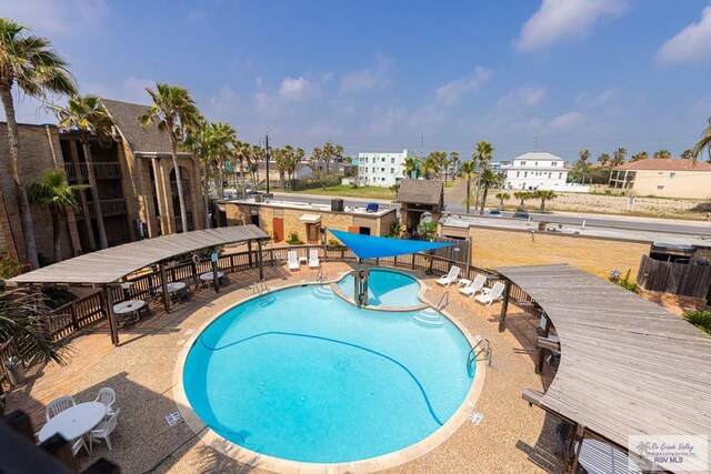 community pool with a patio