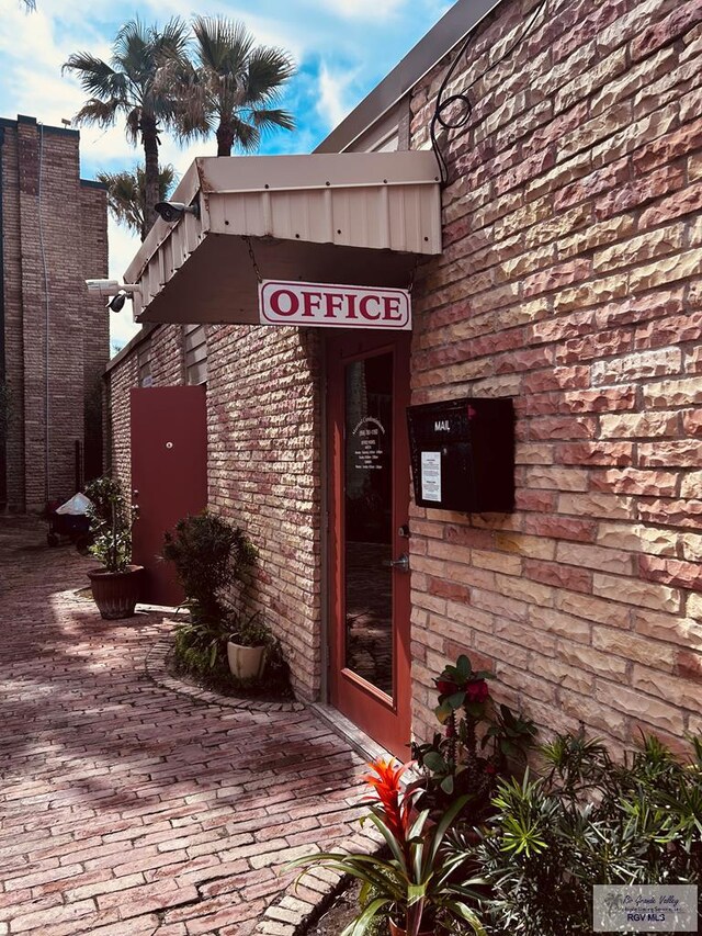 entrance to property with brick siding