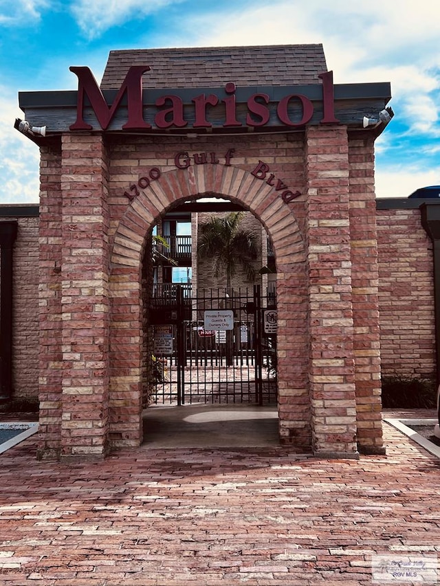 exterior space featuring fence and a gate