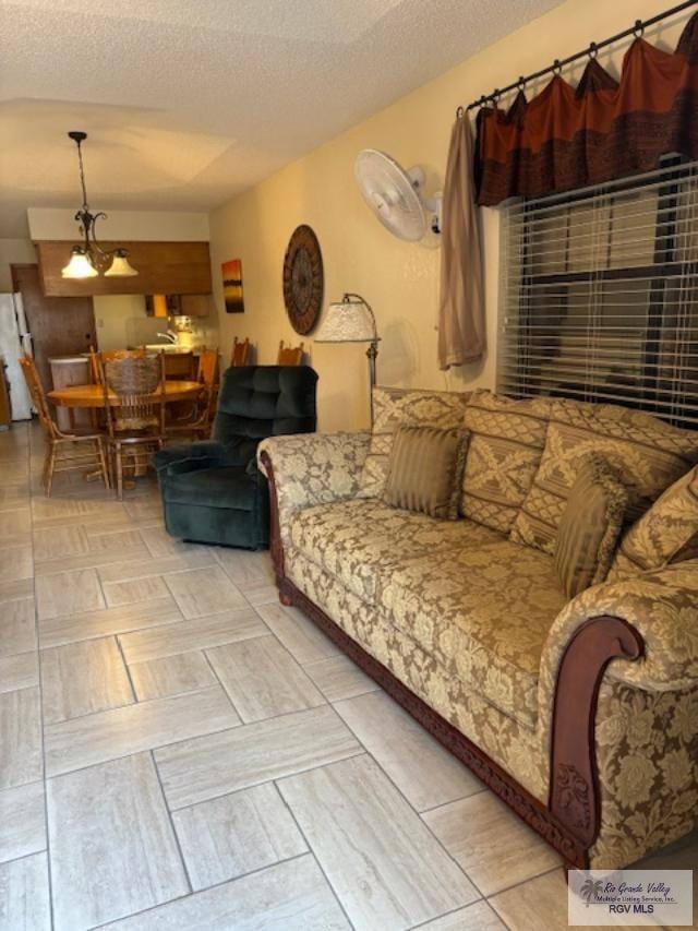 living room with a textured ceiling